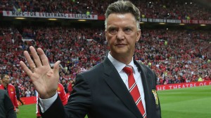MANCHESTER, ENGLAND - AUGUST 12:  Manager Louis van Gaal of Manchester United waves to the crowd ahead of the Pre Season Friendly match between Manchester United and Valencia at Old Trafford on August 12, 2014 in Manchester, England.  (Photo by John Peters/Man Utd via Getty Images)